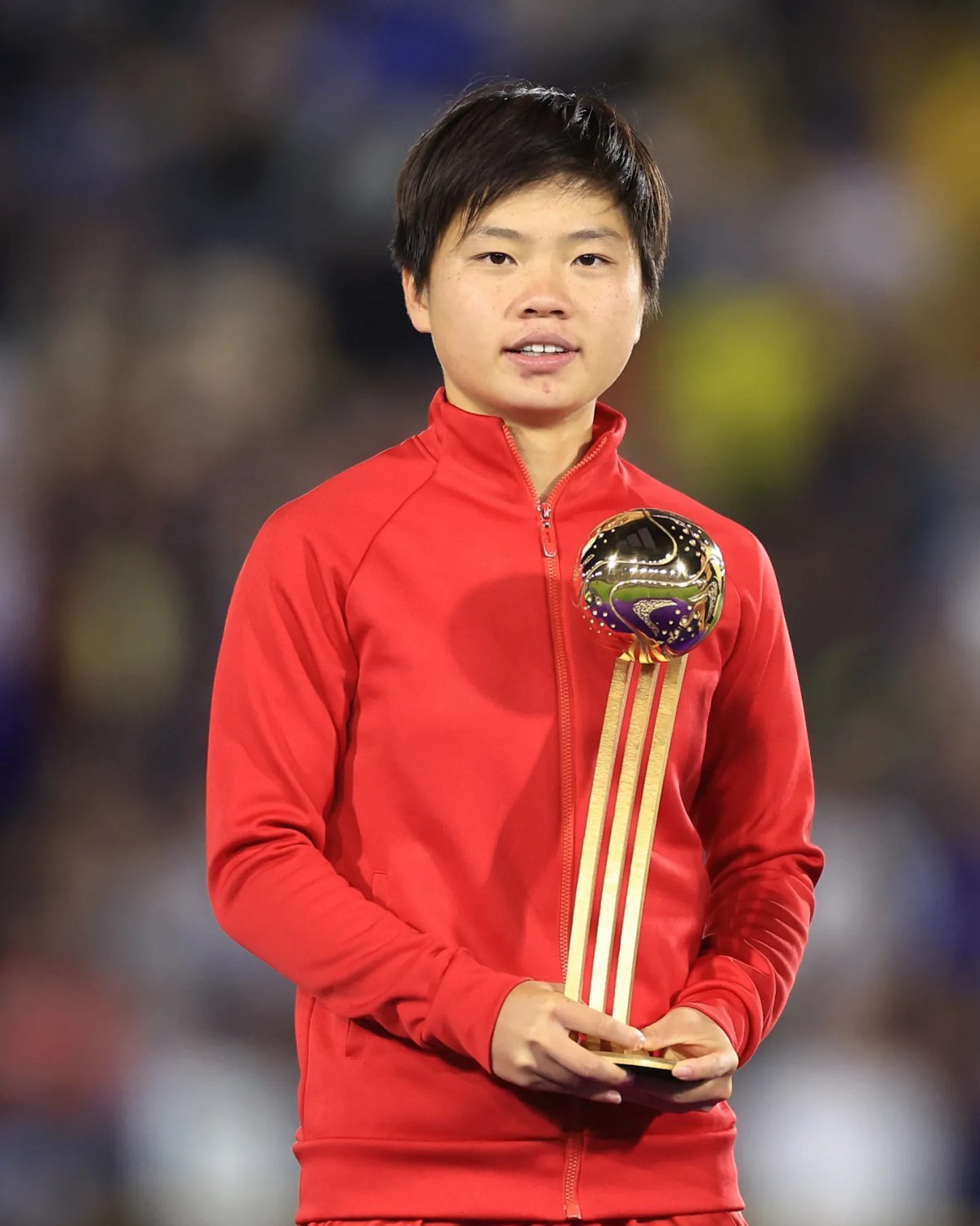 Choi Il-seon receiving the Golden Ball trophy. Photo credit: FIFA Women's World Cup Facebook