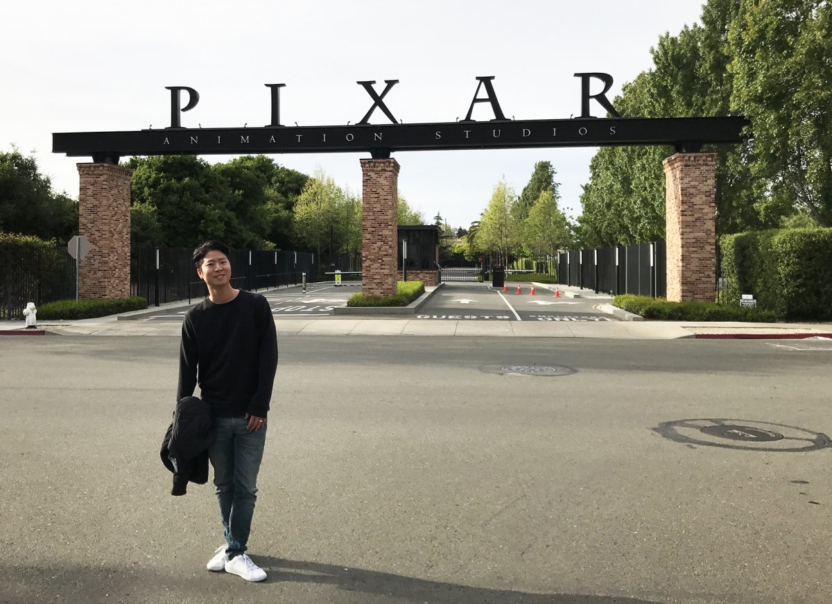 Director Eric Oh is posing in front of the Pixar entrance when he was working at Pixar. Provided by director Eric Oh.