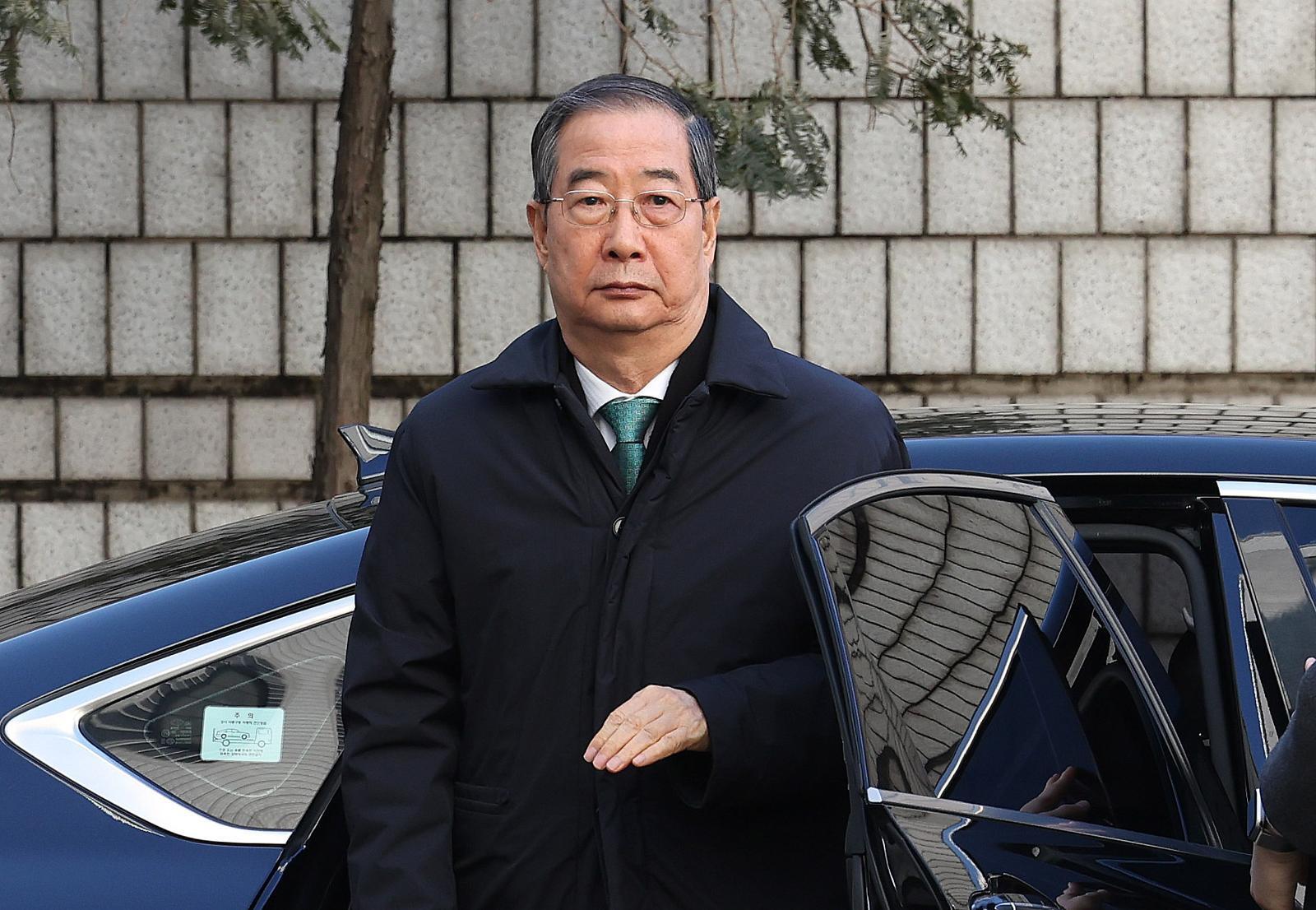 한덕수 전 국무총리가 21일 오후 서울 서초구 서울중앙지법에서 열린 내란 우두머리 방조, 내란 중요임무 종사 혐의 사건 1심 선고공판에 출석하고 있다. 2026.1.21/뉴스1