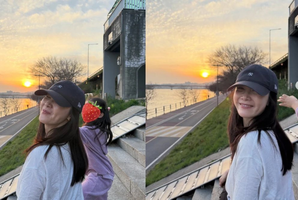 배우 최지우가 딸과 함께한 산책 일상을 공개했다. 노을이 물든 강변에서의 따뜻한 모습이 관심을 끌고 있다. ⓒ뉴시스
