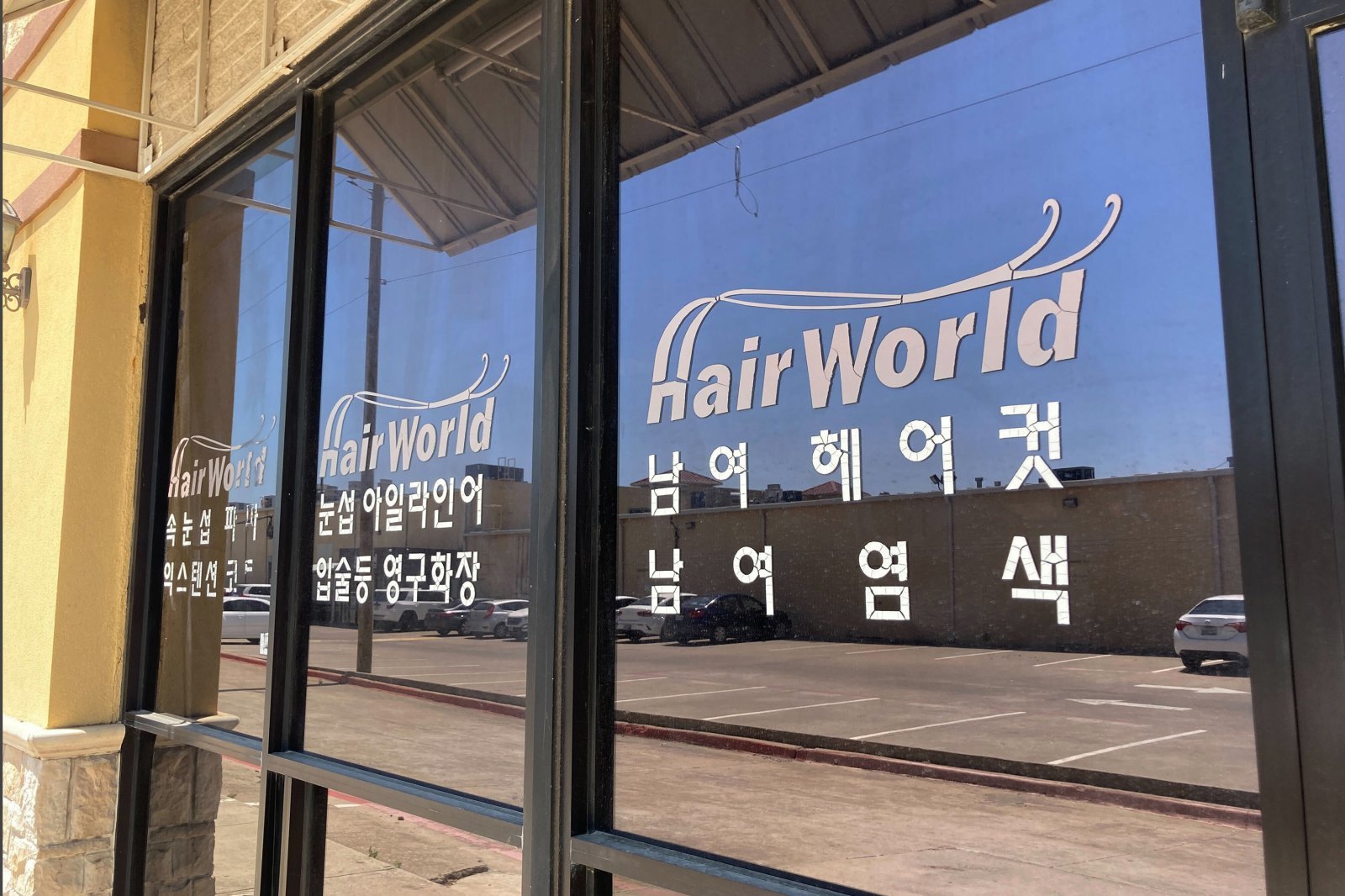 CORRECTS THE PHOTOGRAPHER‘S LAST NAME TO STENGLE, INSTEAD OF STENGEL This photo shows the interior of Hair World Salon in Dallas on Thursday, May 12, 2022. Police searched Thursday for a man who opened fire inside the hair salon in Dallas’ Koreatown area, wounding three people. Authorities do not yet know why the man shot the three female victims Wednesday afternoon at Hair World Salon, which is in a shopping center with many businesses owned by Korean Americans. (AP Photo/Jamie Stengle)