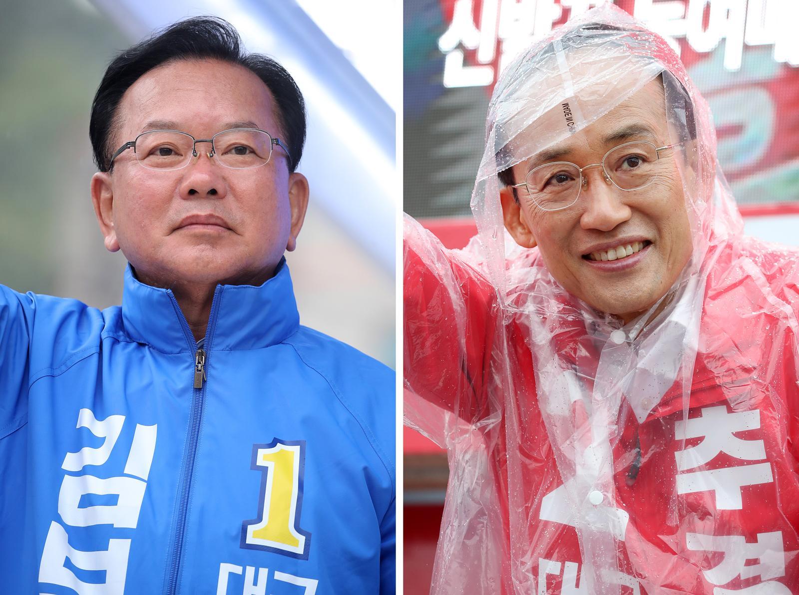 김부겸 더불어민주당 대구시장 후보(왼쪽)가 27일 오전 대구 북구 태전네거리에서 출근길 시민들을 향해 인사하고 있다.  같은 날 오전 추경호 국민의힘 대구시장 후보는 북구 팔달교 앞에서 아침 인사를 하고 있다. 2026.5.27. 뉴스1