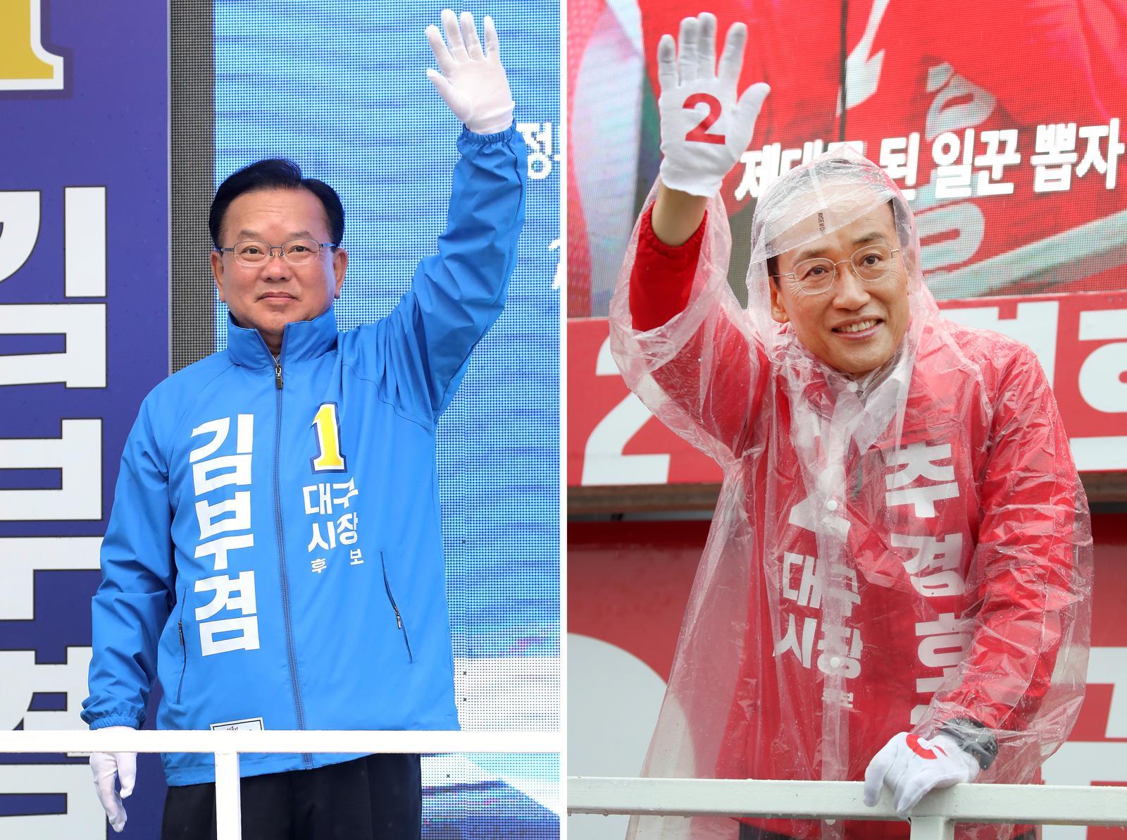 김부겸 더불어민주당 대구시장 후보(왼쪽)가 27일 오전 대구 북구 태전네거리에서 출근길 시민들을 향해 인사하고 있다. 같은 날 오전 추경호 국민의힘 대구시장 후보는 북구 팔달교 앞에서 아침 인사를 하고 있다. 2026.5.27 ⓒ 뉴스1