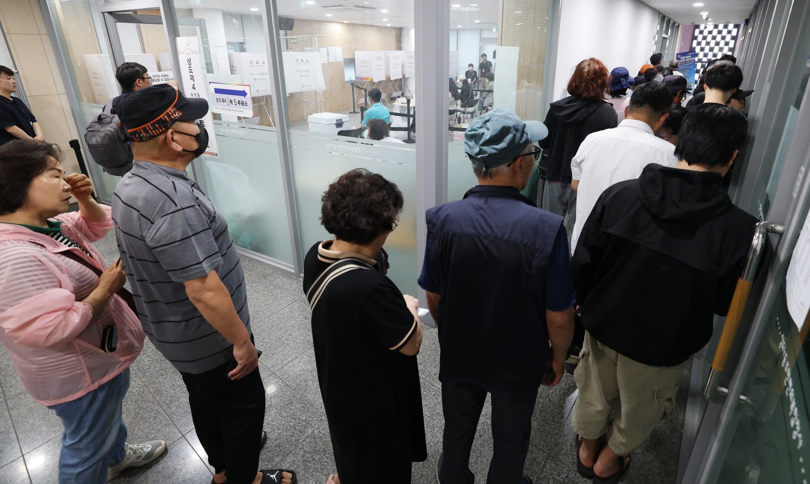 Voters Queue Early for Election Day in Seoul