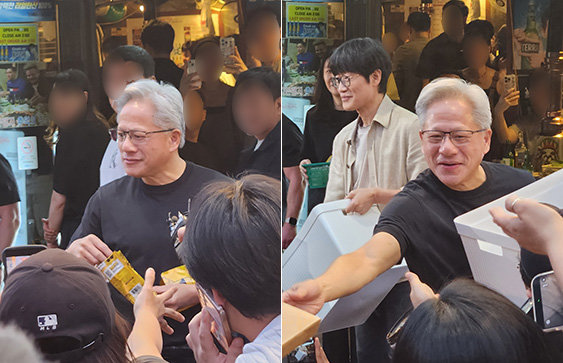 젠슨 황 엔비디아 최고경영자(CEO)가 5일 오후 서울 마포구 홍익대학교 인근의 삼겹살 음식점 앞에서 시민들에게 HBM칩스 과자를 나눠주고 있다. 박태근 기자 ptk@donga.com·황수영 기자 ghkdtndud119@donga.com