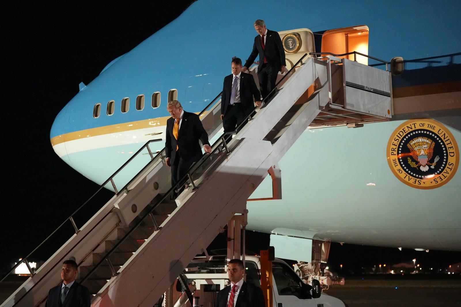President Donald Trump switches planes at U.S. Air Force Base, RAF Mildenhall in Suffolk Eastern England, on his way back to Washington from the NATO summit in Ankara, Turkey, Wednesday, July 8, 2026. (AP Photo/Alex Brandon)