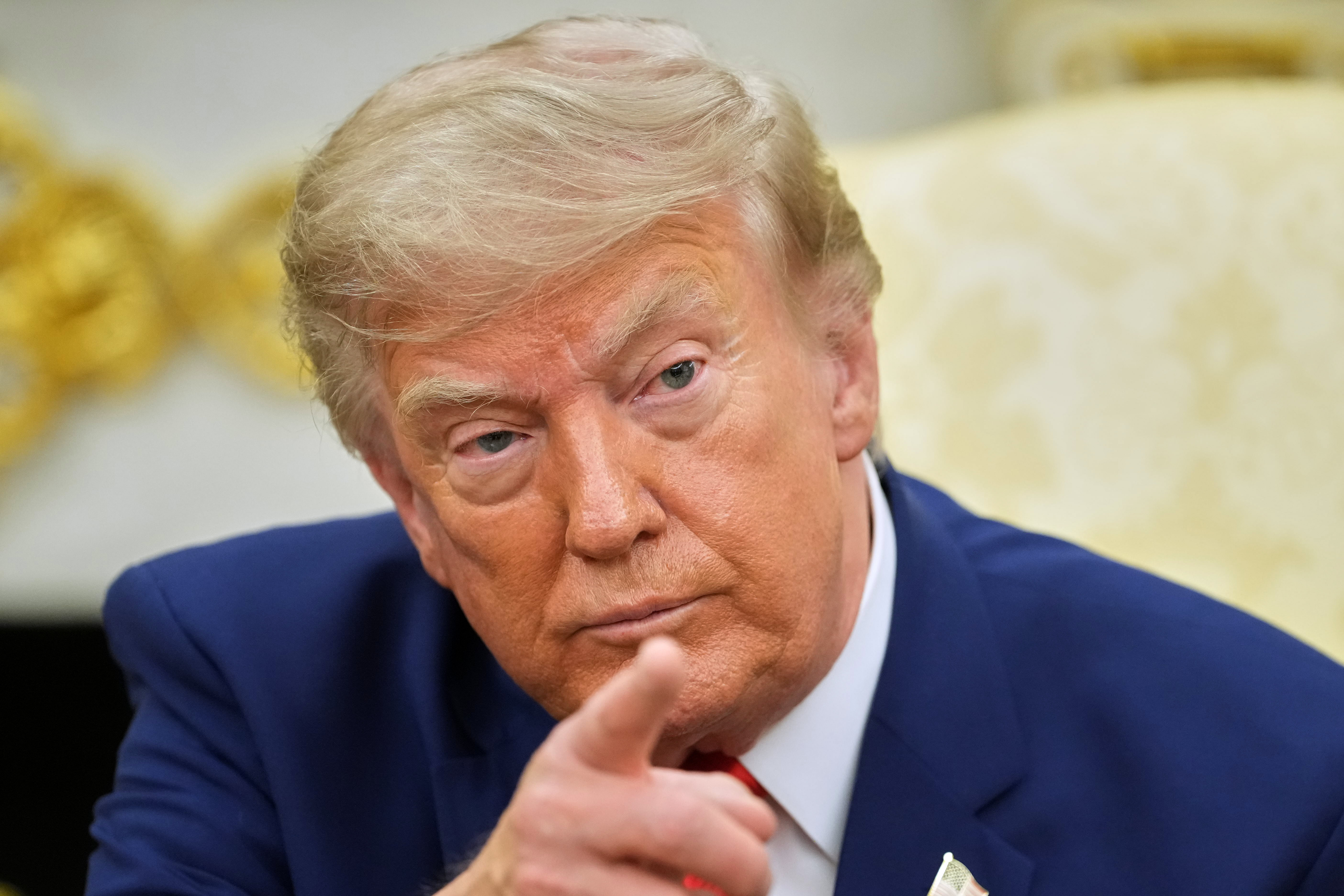 Trump threatens Iran nuclear site, vows to handle Red Sea blockade