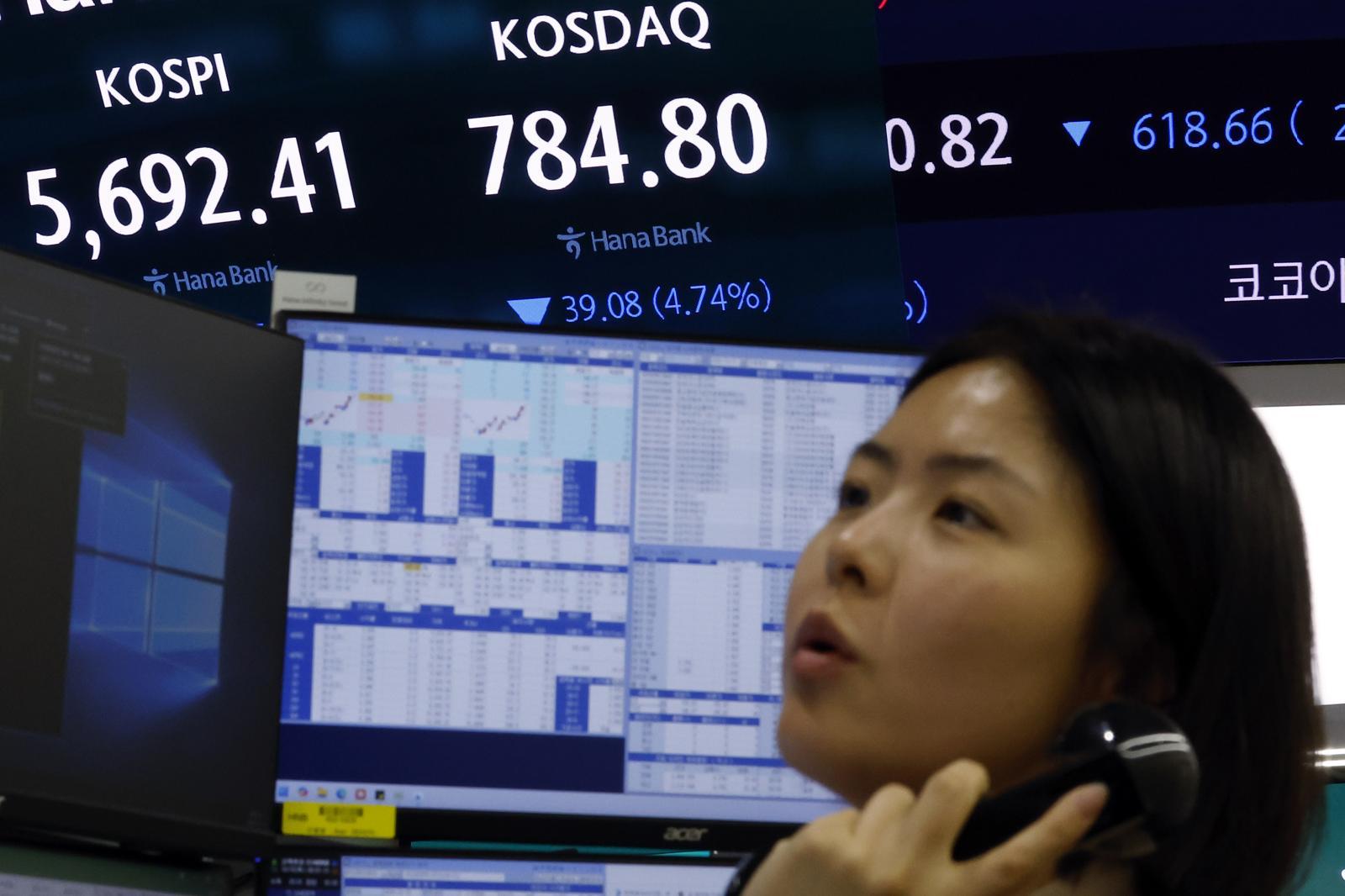 South Korean stocks fall as sell-sidecars halt automated orders