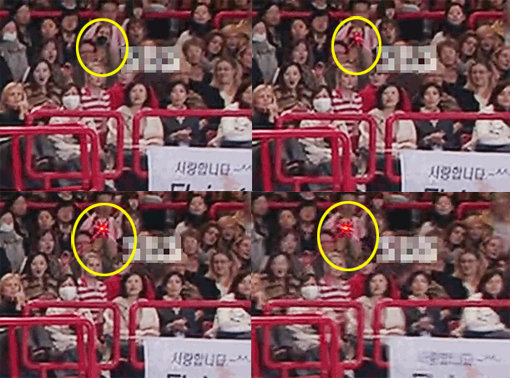 한 외국 여성의 카메라에서 나오는 붉은 빛