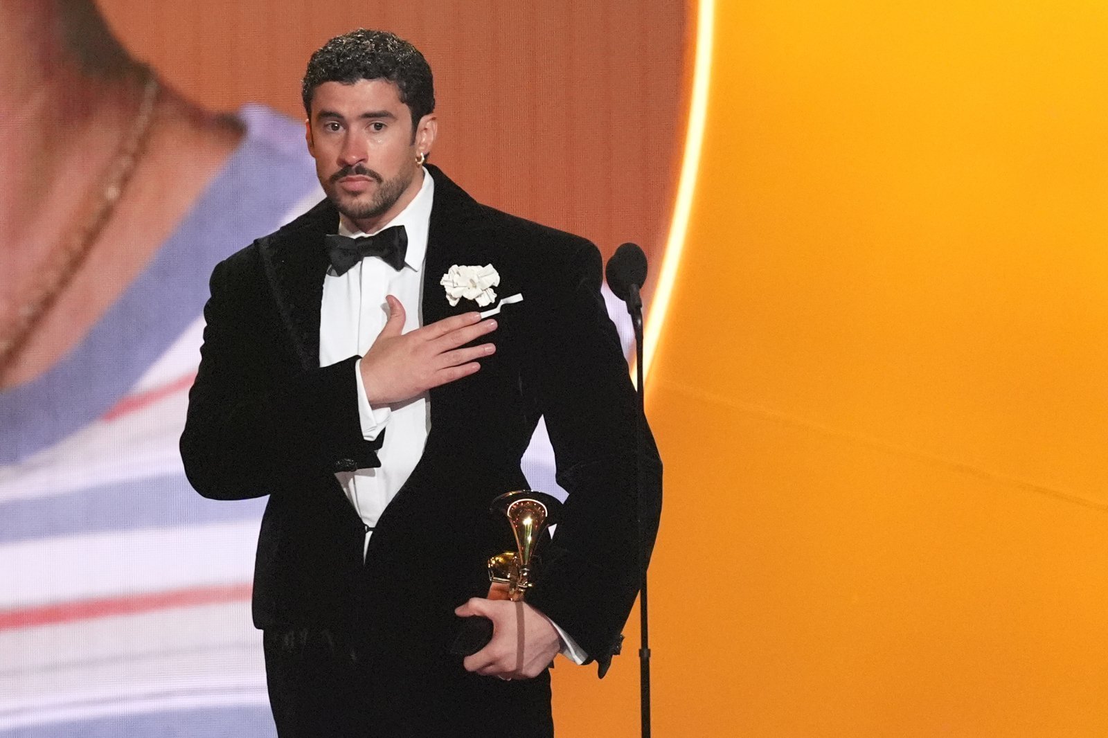 Bad Bunny accepts the award for album of the year for “Debi Tirar Mas Fotos” during the 68th annual Grammy Awards on Sunday, Feb. 1, 2026, in Los Angeles. (AP Photo/Chris Pizzello)