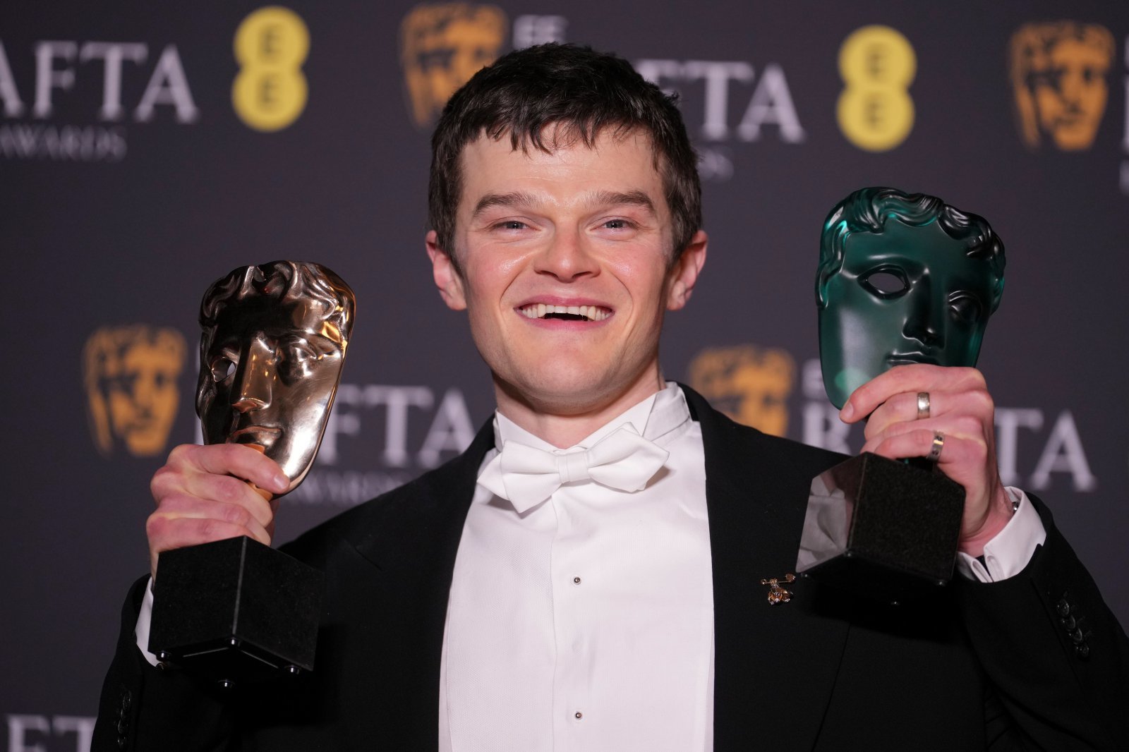 Robert Aramayo poses with the EE rising star award and the award for leading actor for ‘I Swear’ at the 79th British Academy Film Awards, BAFTA‘s, in London, Sunday, Feb. 22, 2026. (AP Photo/Alastair Grant)