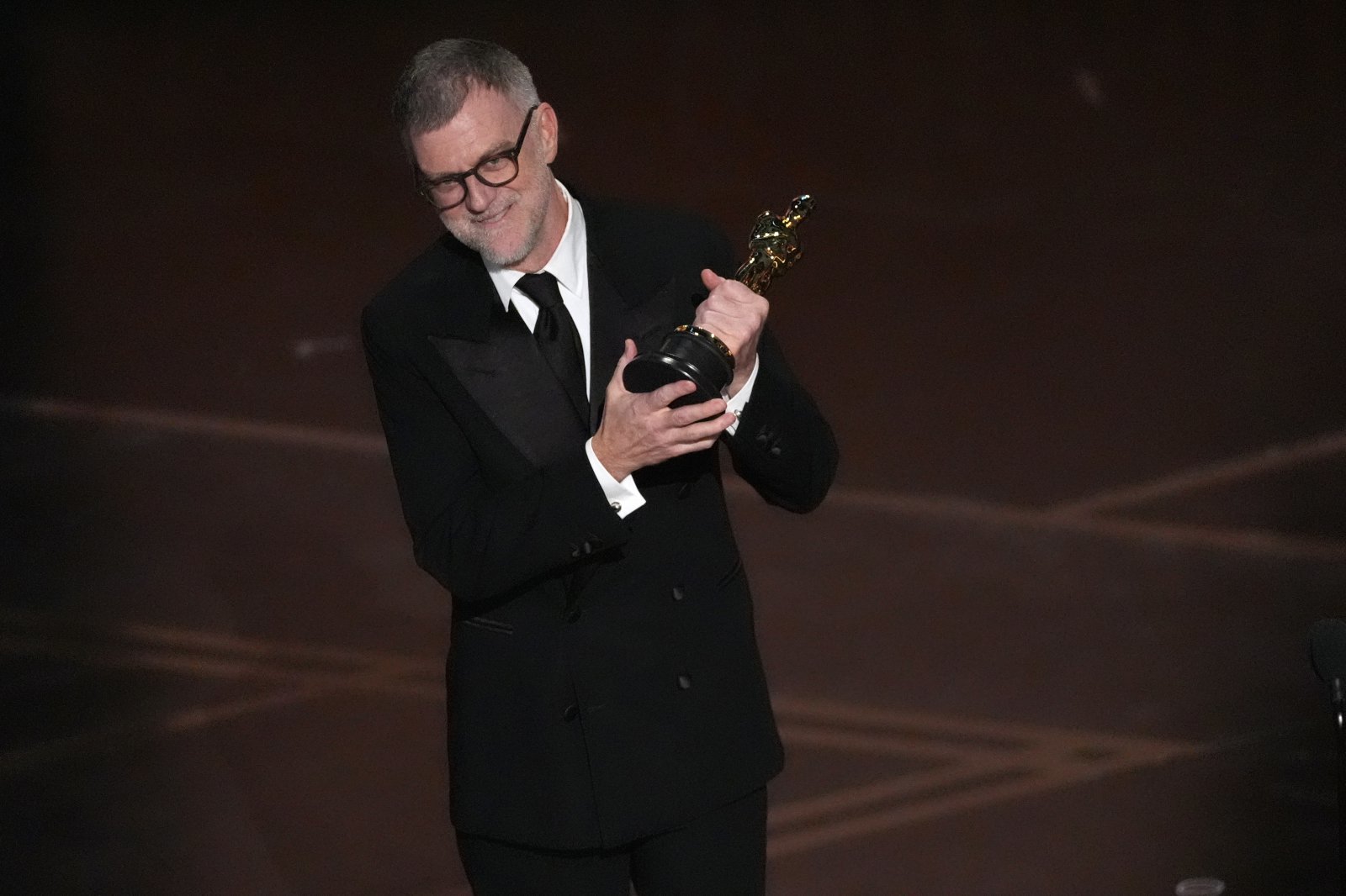Paul Thomas Anderson accepts the award for directing for “One Battle After Another” during the Oscars on Sunday, March 15, 2026, at the Dolby Theatre in Los Angeles. (AP Photo/Chris Pizzello)