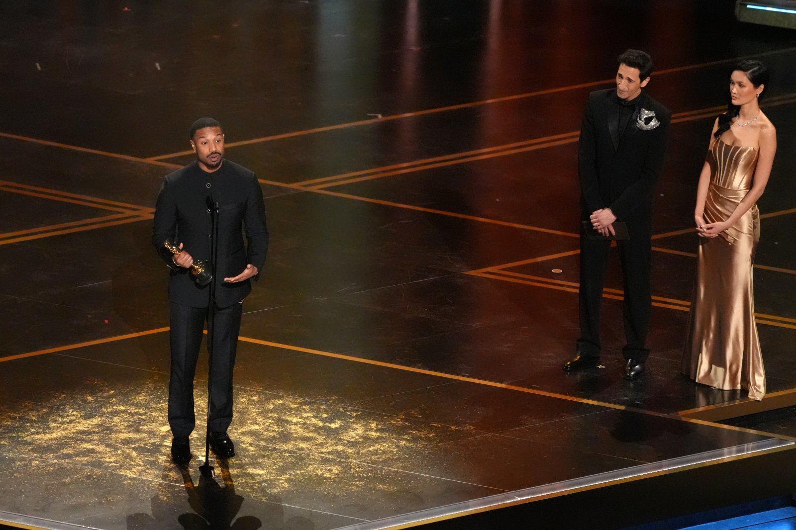 Michael B. Jordan accepts the award for actor in a leading role for “Sinners” during the Oscars on Sunday, March 15, 2026, at the Dolby Theatre in Los Angeles. Adrien Brody looks on from right.(AP Photo/Chris Pizzello)