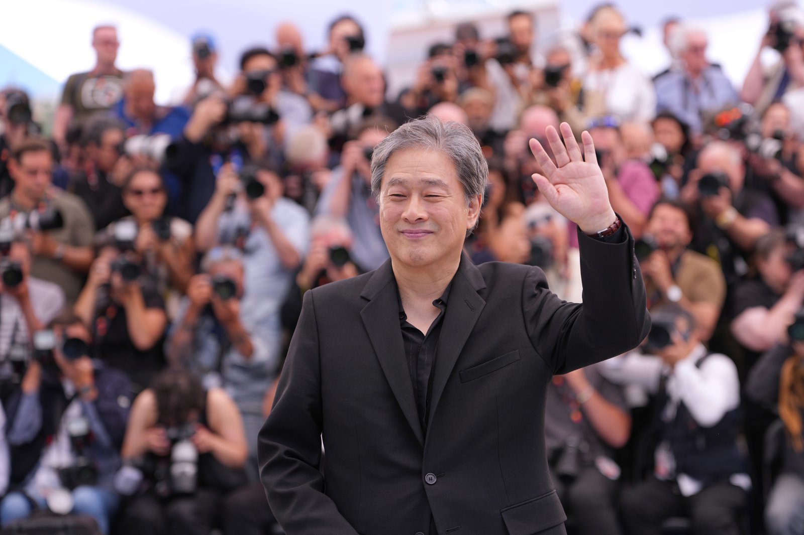 Jury president Park Chan-wook poses for photographers at the jury photo call at the 79th international film festival, Cannes, southern France, Tuesday, May 12, 2026. (AP Photo/Andreea Alexandru)