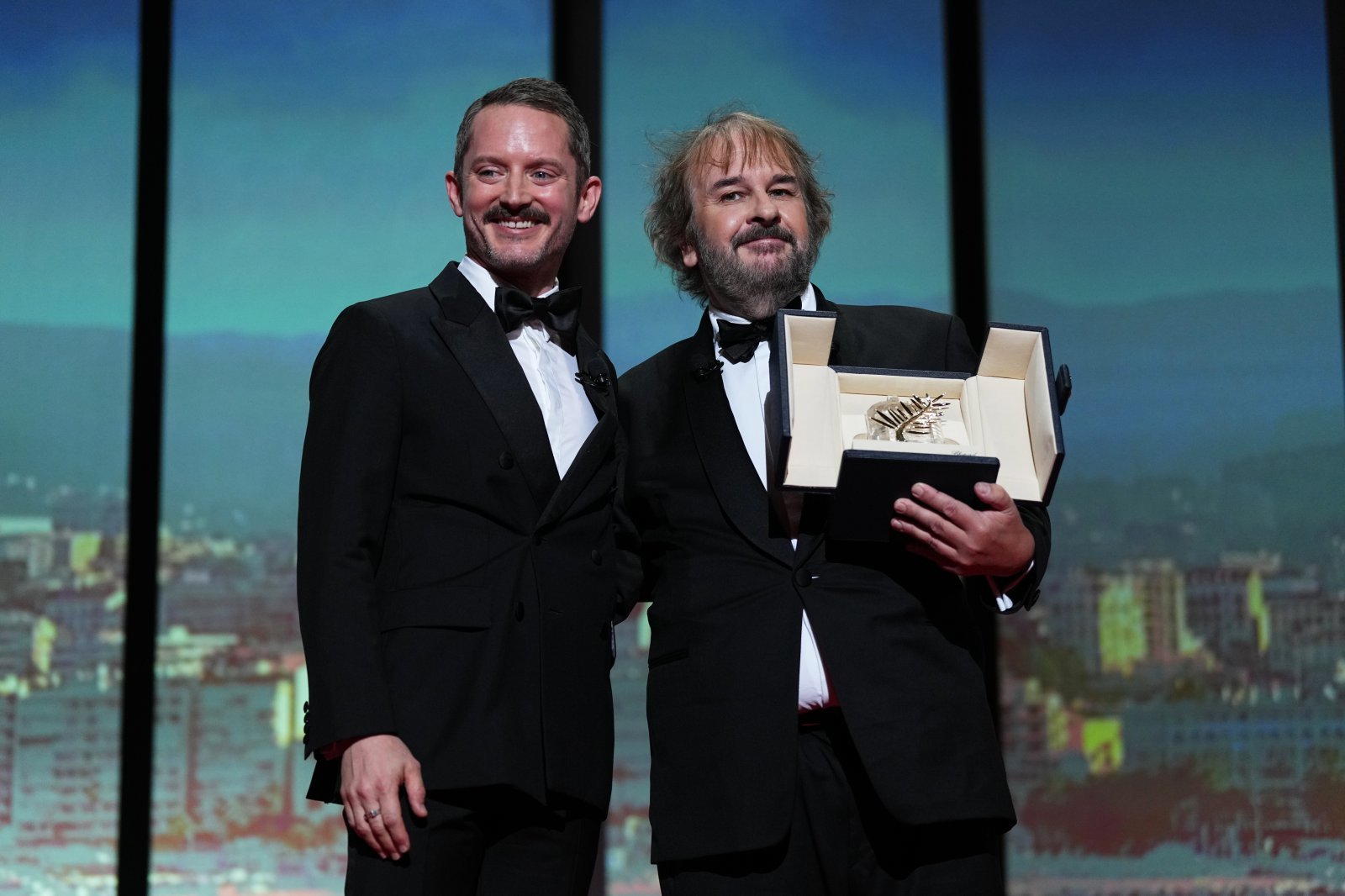 Elijah Wood, from left, and director Peter Jackson, recipient of the honorary Palme d‘Or, pose for photographers during the opening ceremony of the 79th international film festival, Cannes, southern France, Tuesday, May 12, 2026. (Photo by Scott A Garfitt/Invision/AP)