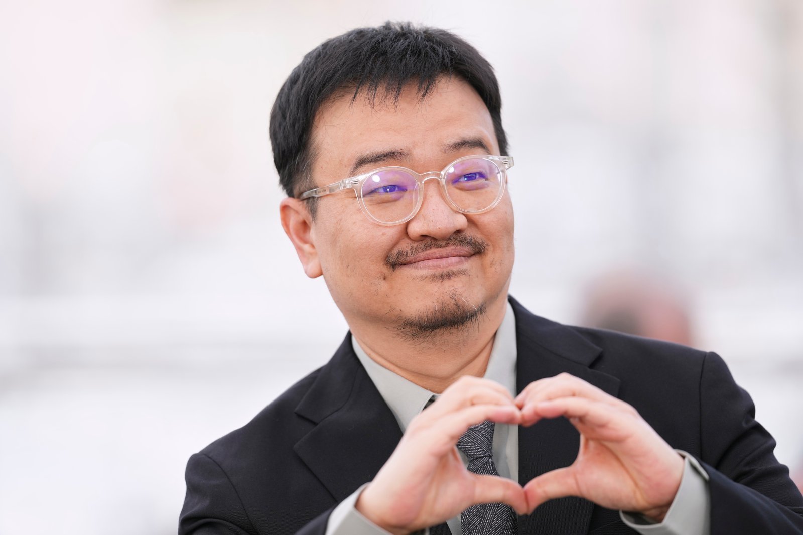 Director Yeon Sang-ho poses for photographers at the photo call for the film ‘Colony’ during the 79th international film festival, Cannes, southern France, Friday, May 15, 2026. (Photo by Scott A Garfitt/Invision/AP)
