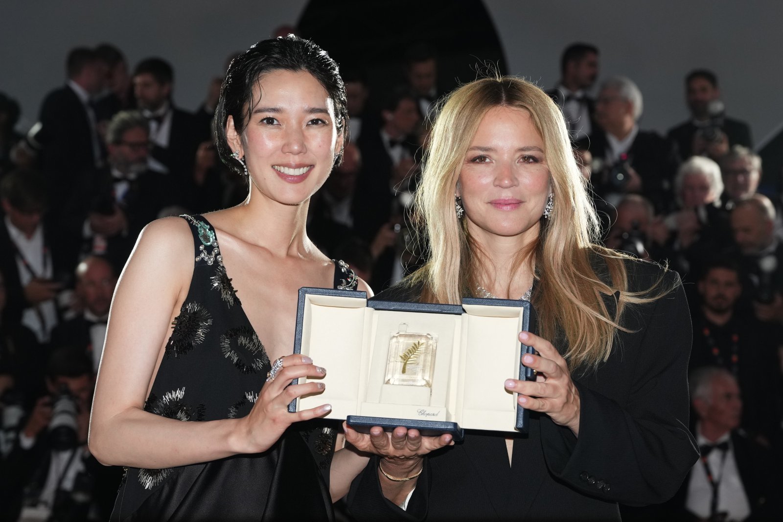 Tao Okamoto, left, and Virginie Efira, winners of the award for best actress for ‘All of a Sudden,’ pose for photographers at the awards ceremony photo call during the 79th international film festival, Cannes, southern France, Saturday, May 23, 2026. (Photo by Scott A Garfitt/Invision/AP)
