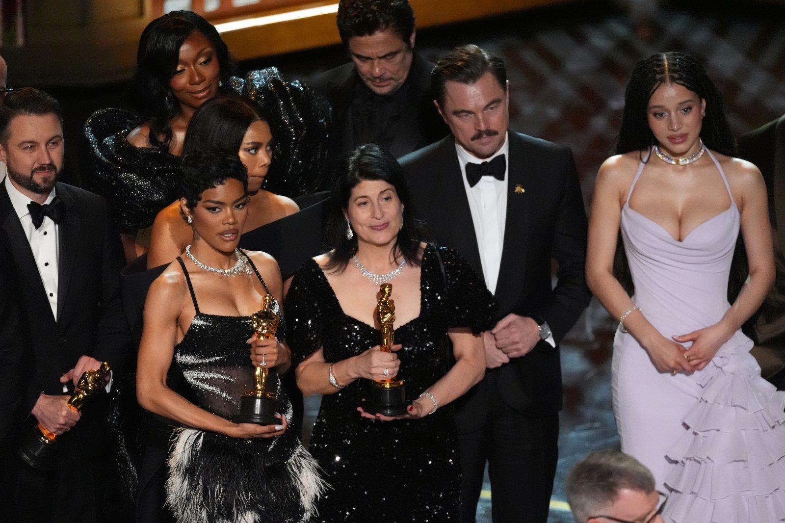 Andy Jurgensen, from left, Shayna McHale, Benicio del Toro, Teyana Taylor, Regina Hall, Cassandra Kulukundis, Leonardo DiCaprio,and Chase Infiniti accept the award for best picture for “One Battle After Another” during the Oscars on Sunday, March 15, 2026, at the Dolby Theatre in Los Angeles. (AP Photo/Chris Pizzello)