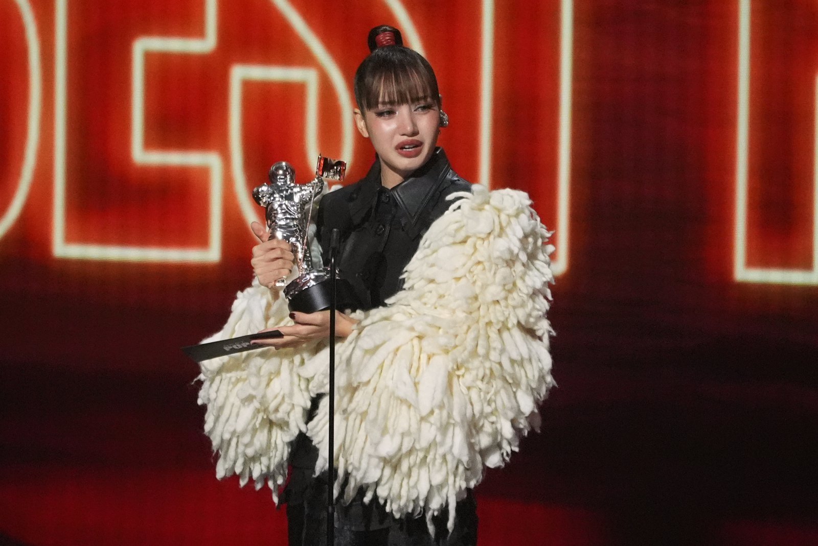 Lisa accepts the award for best pop for “Dream feat. Kentara Sakaguchi” during the MTV Video Music Awards on Sunday, Sept. 27, 2026, at the Peacock Theater in Los Angeles. (AP Photo/Chris Pizzello)